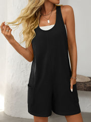 Black sleeveless utility romper with seam details and cargo pockets.
