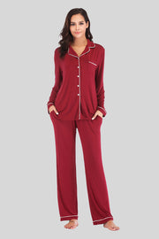 Piped trim pajama set in wine with long sleeves, button front, chest pocket and side pockets.