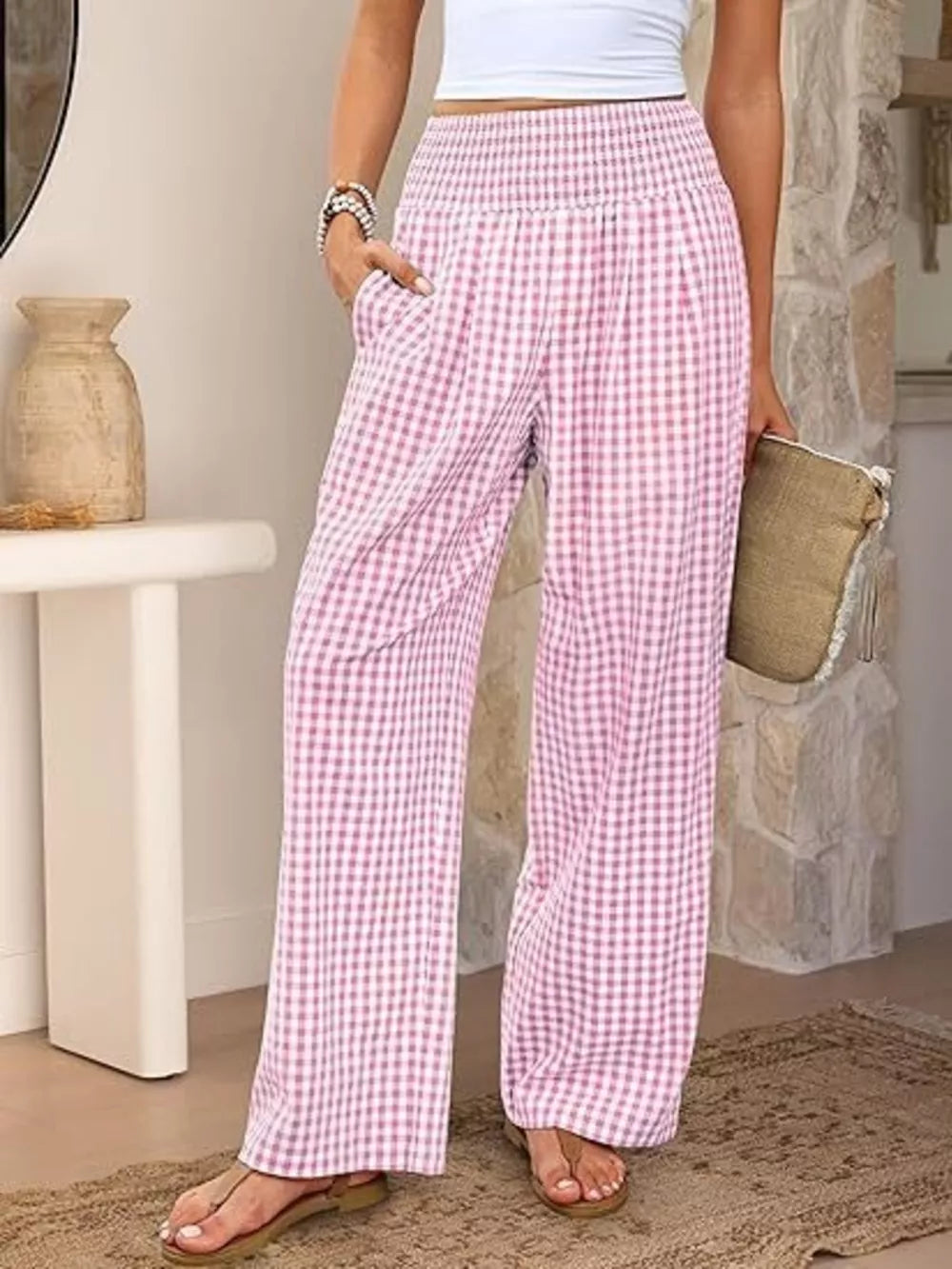 Pink plaid maternity pants with smocked waistband and wide legs.