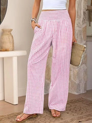 Pink plaid maternity pants with smocked waistband and wide legs.