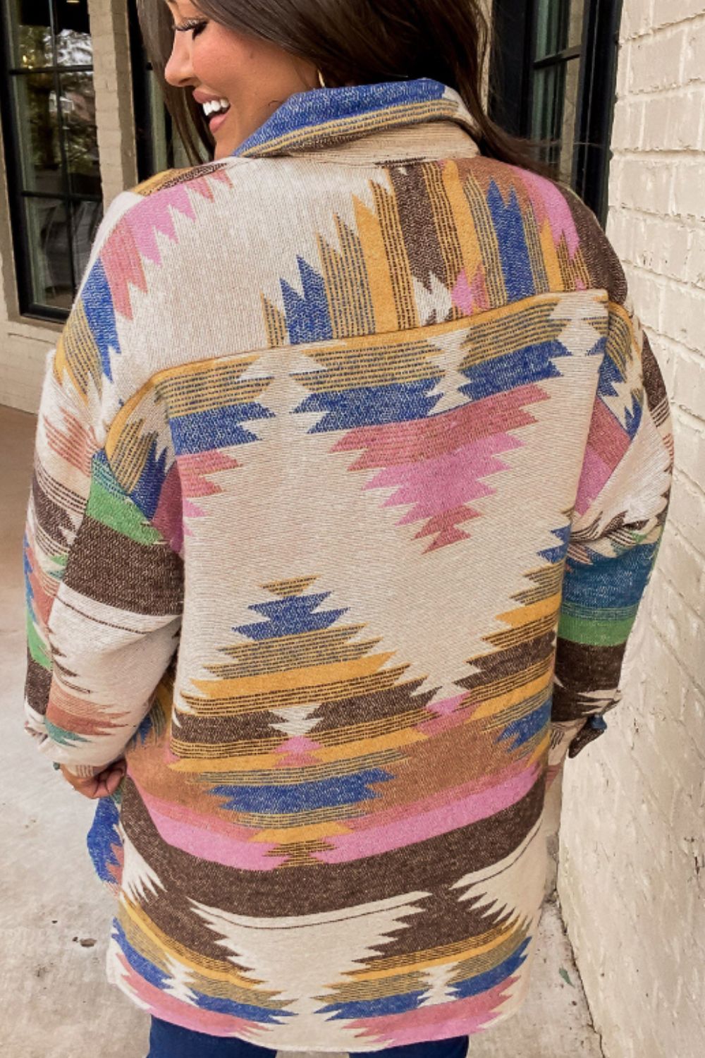 Southwestern print shirt jacket in beige with colorful geometric patterns and button details.