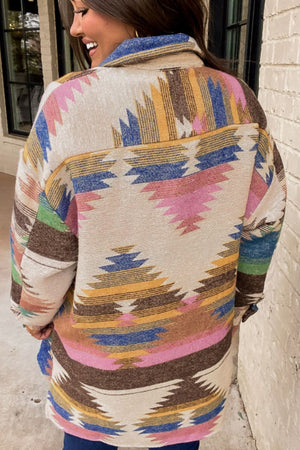 Southwestern print shirt jacket in beige with colorful geometric patterns and button details.