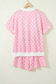 Pink polka dot polyester top and shorts set with white trim