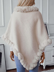 Beige knit poncho with faux fur trim at neckline and hem, acrylic, casual style.