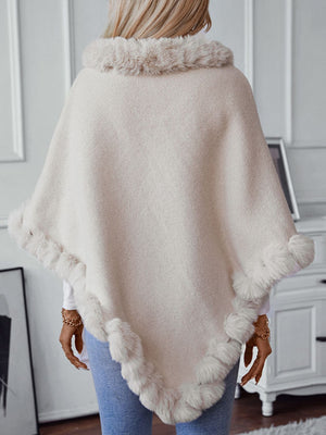 Beige knit poncho with faux fur trim at neckline and hem, acrylic, casual style.