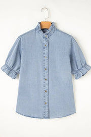 Light blue denim blouse with ruffled collar, puff sleeves, and button front.