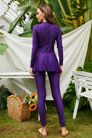 Violet long sleeve swimsuit with flounce hem and full length leggings.