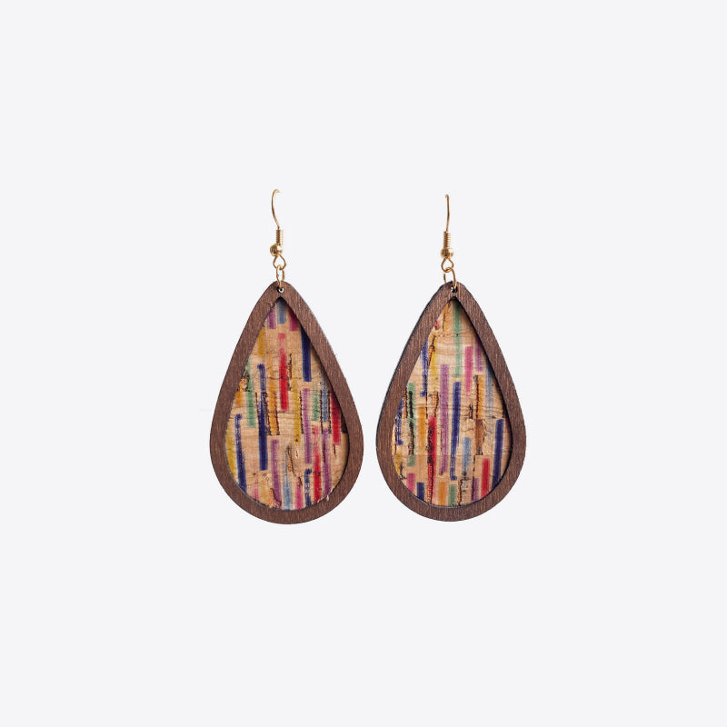 Cork and stripe teardrop statement earrings with wooden frame and colorful vertical lines.