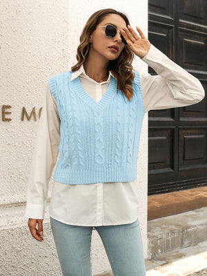 Pastel blue cable knit crop vest sweater with V-neck and acrylic material.