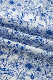Maxi dress in white with a blue floral print and knot detail