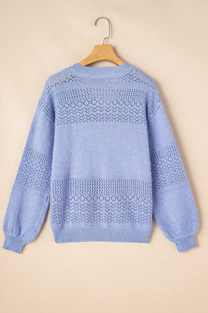 Light blue perforated knit V-neck pullover sweater with textured details.