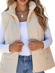 Off-white corduroy zip-up vest coat with quilted detail and high collar.
