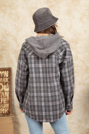 Cozy plaid shacket in Dark Gray with sherpa hood and buttoned cuffs.