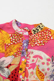 Patchwork floral print blouse in strawberry pink with a band collar and button front.