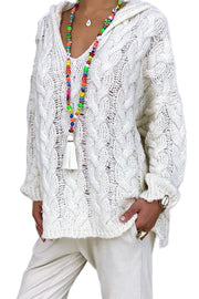 White cable knit hooded cocoon sweater with V-neck and textured acrylic knit.