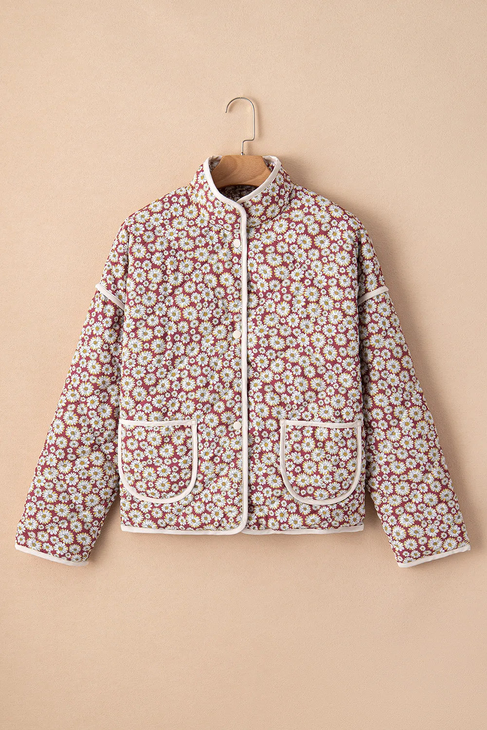 Burgundy quilted jacket with daisy print, stand collar, and contrast trim.