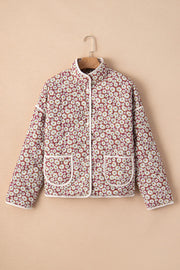 Burgundy quilted jacket with daisy print, stand collar, and contrast trim.