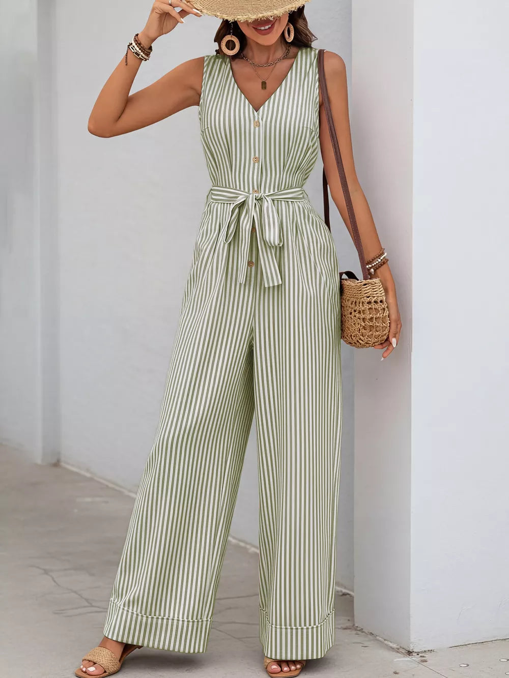 Yellow-green striped tie-waist wide leg romper with decorative buttons and V-neck