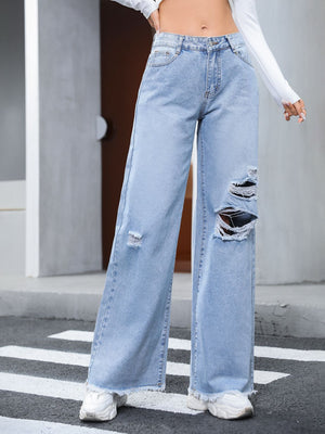 Light wash distressed wide-leg jeans with fray hem and ripped details.