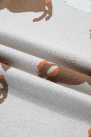 Equestrian-inspired knit sweater in beige with brown horse pattern and puff sleeves.