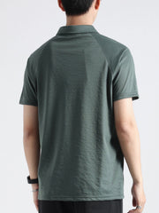 Dark green cotton blend polo shirt with short sleeves and a classic collar, shown from the back.