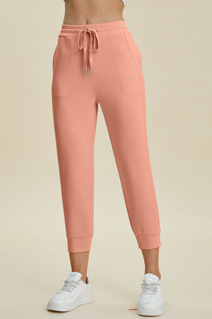 Coral joggers with drawstring waist and cuffed ankles