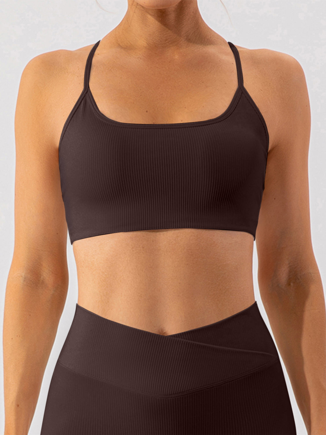 Chocolate ribbed halterneck active bra with square neckline and thin straps.
