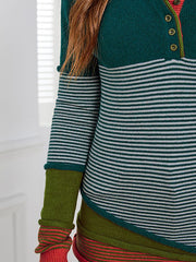 Colorblock henley knit shirt with stripes, green and white stripes, button neck, and contrast sleeves.