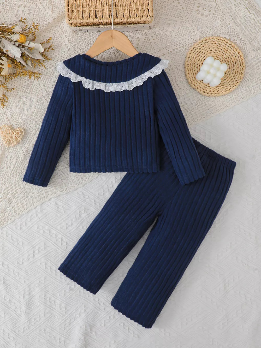 Navy ribbed knit toddler set with lace collar and long sleeves.
