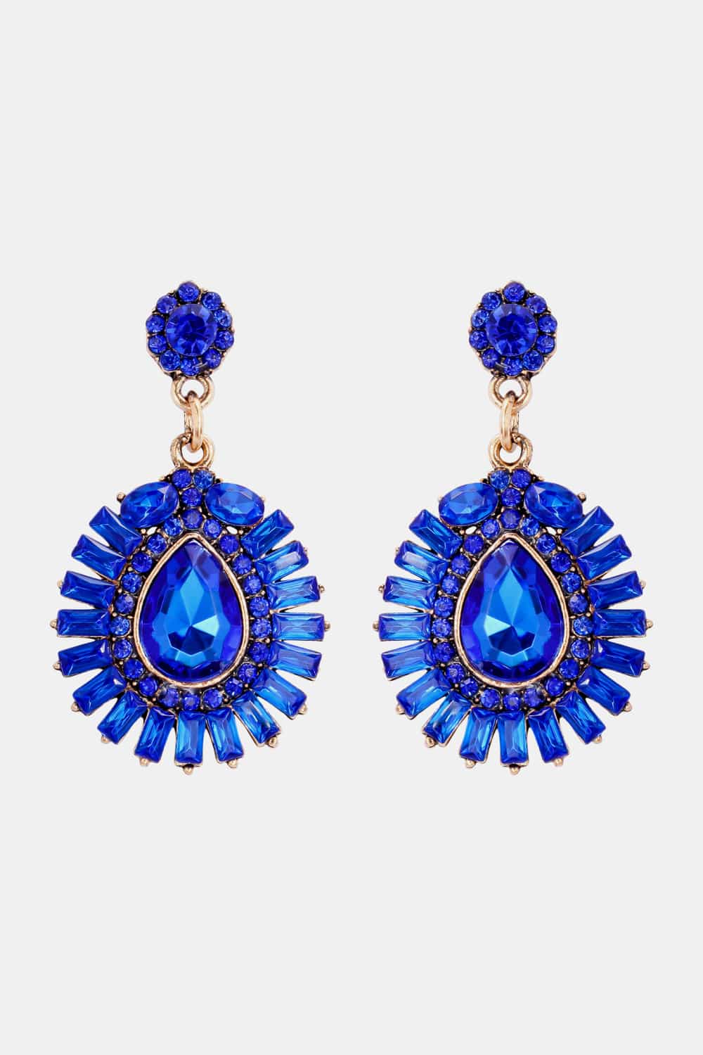Royal blue dangle earrings with teardrop and baguette gemstones.