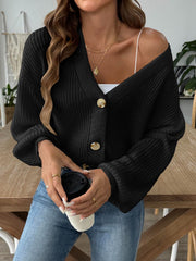 Black balloon sleeve button-down knit cardigan with tan buttons.