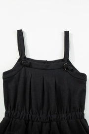 Black waffle knit jumpsuit with adjustable tie straps and elastic waist