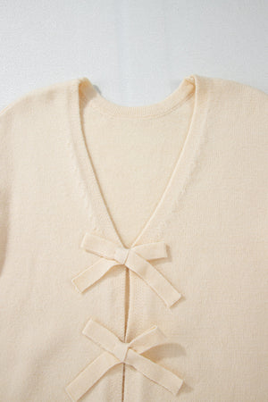 Ivory bouclé knit cardigan with tie-front bow details