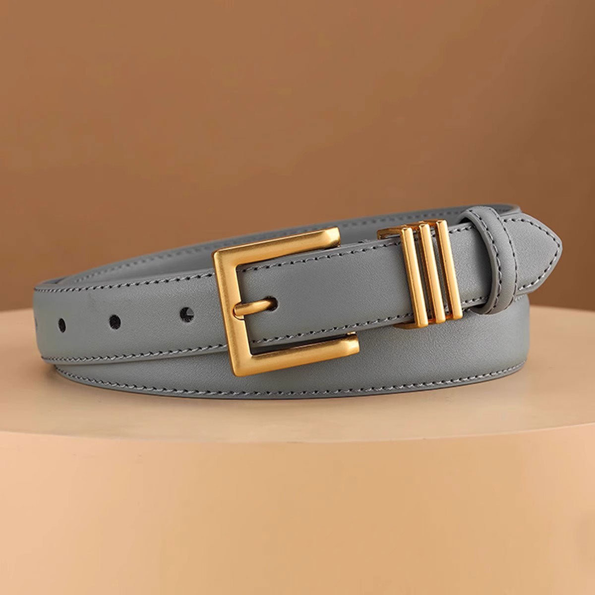 Grey cowhide leather belt with gold buckle and triple bar detail
