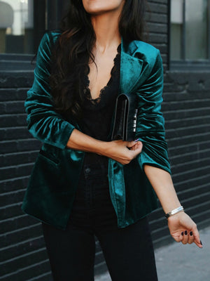 Deep Teal velvet tailored blazer with button closure and black trim detail.