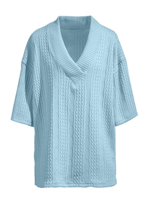 Sky blue cable-knit v-neck sweater with short sleeves and a relaxed fit.