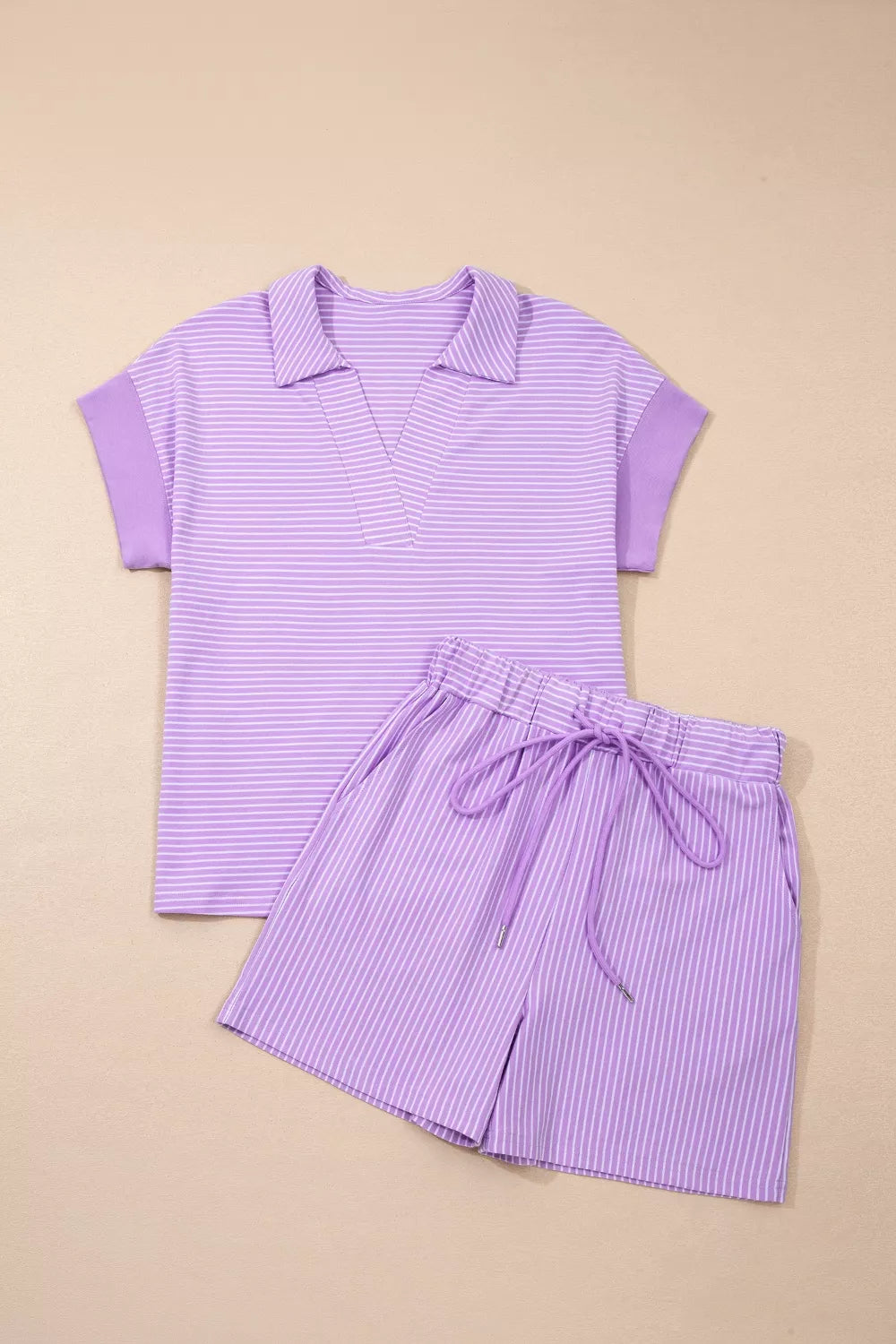 Purple striped polo shirt and drawstring shorts loungewear set.