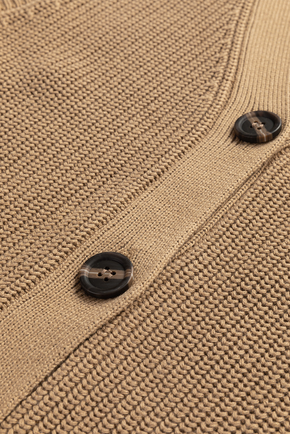 Camel ribbed button-down cardigan vest with dark marbled buttons and textured knit detail.