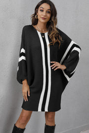 Black oversized stripe knit cocoon dress with balloon sleeves and a V-neck.