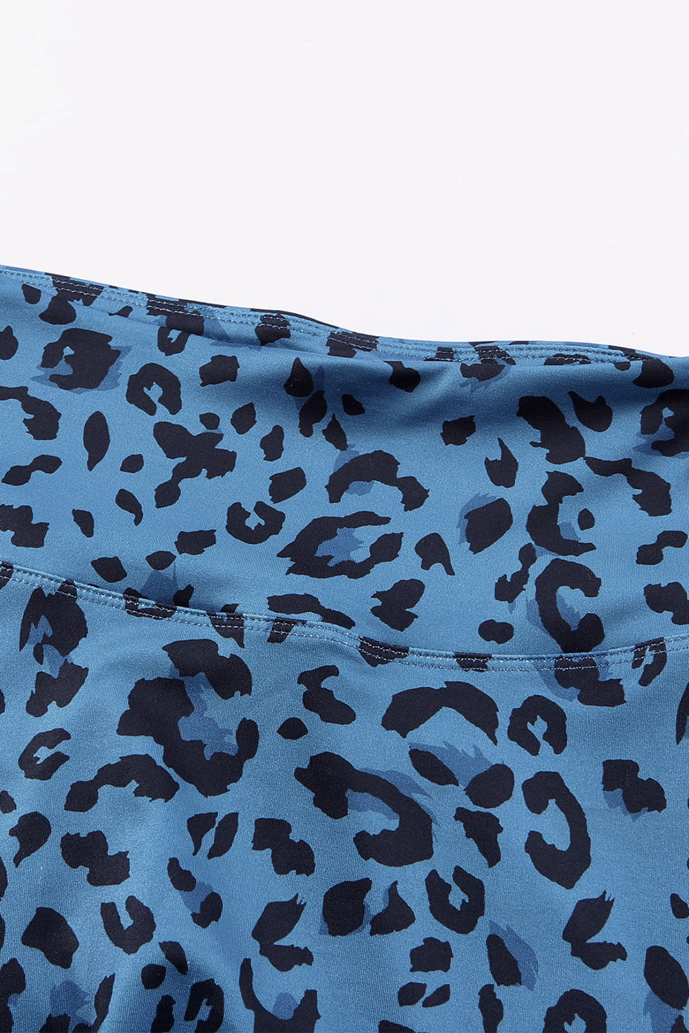 Sky blue performance leggings with bold black leopard print