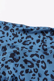 Sky blue performance leggings with bold black leopard print
