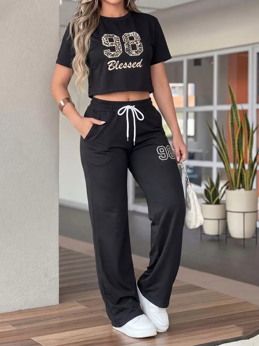 Leopard Print Crop Top And Wide Leg Pants Set in Black, front view