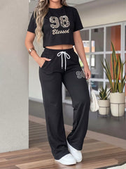 Leopard Print Crop Top And Wide Leg Pants Set in Black, front view