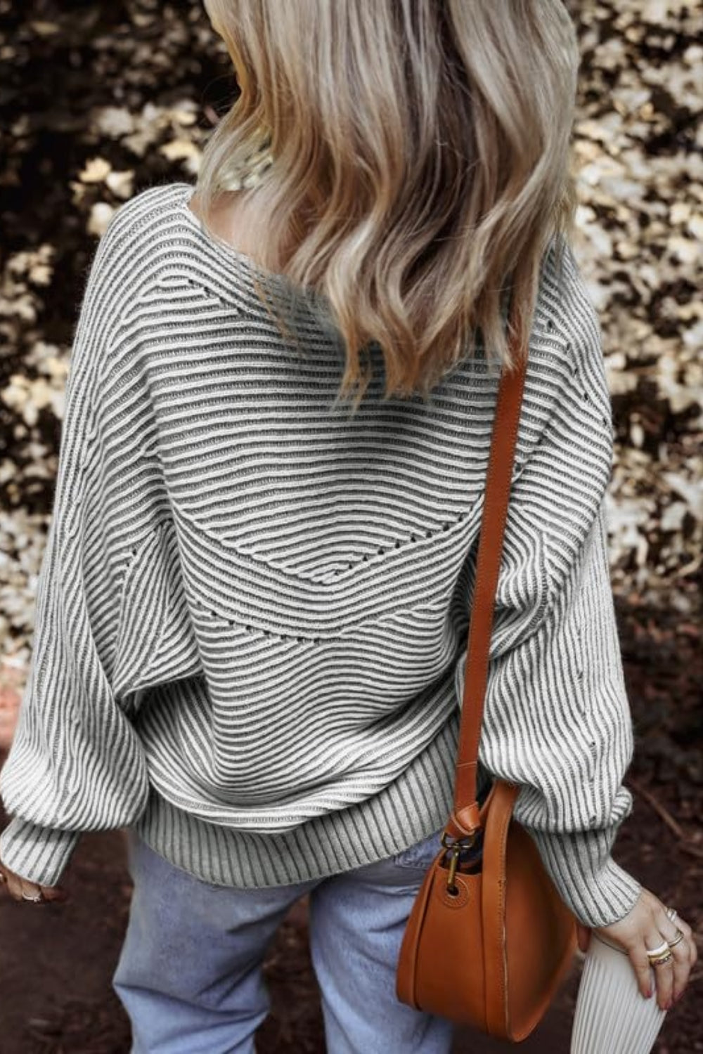 Gray textured stripe batwing knit sweater with a V-shaped yoke detail.