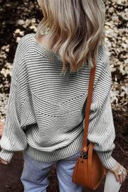 Gray textured stripe batwing knit sweater with a V-shaped yoke detail.