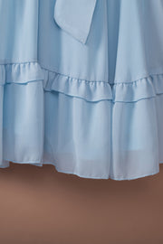 Sky blue ruffled mini dress with bow-tie waist detail