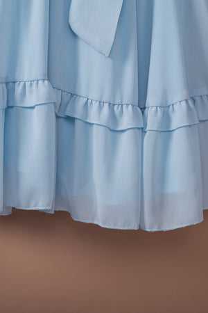 Sky blue ruffled mini dress with bow-tie waist detail