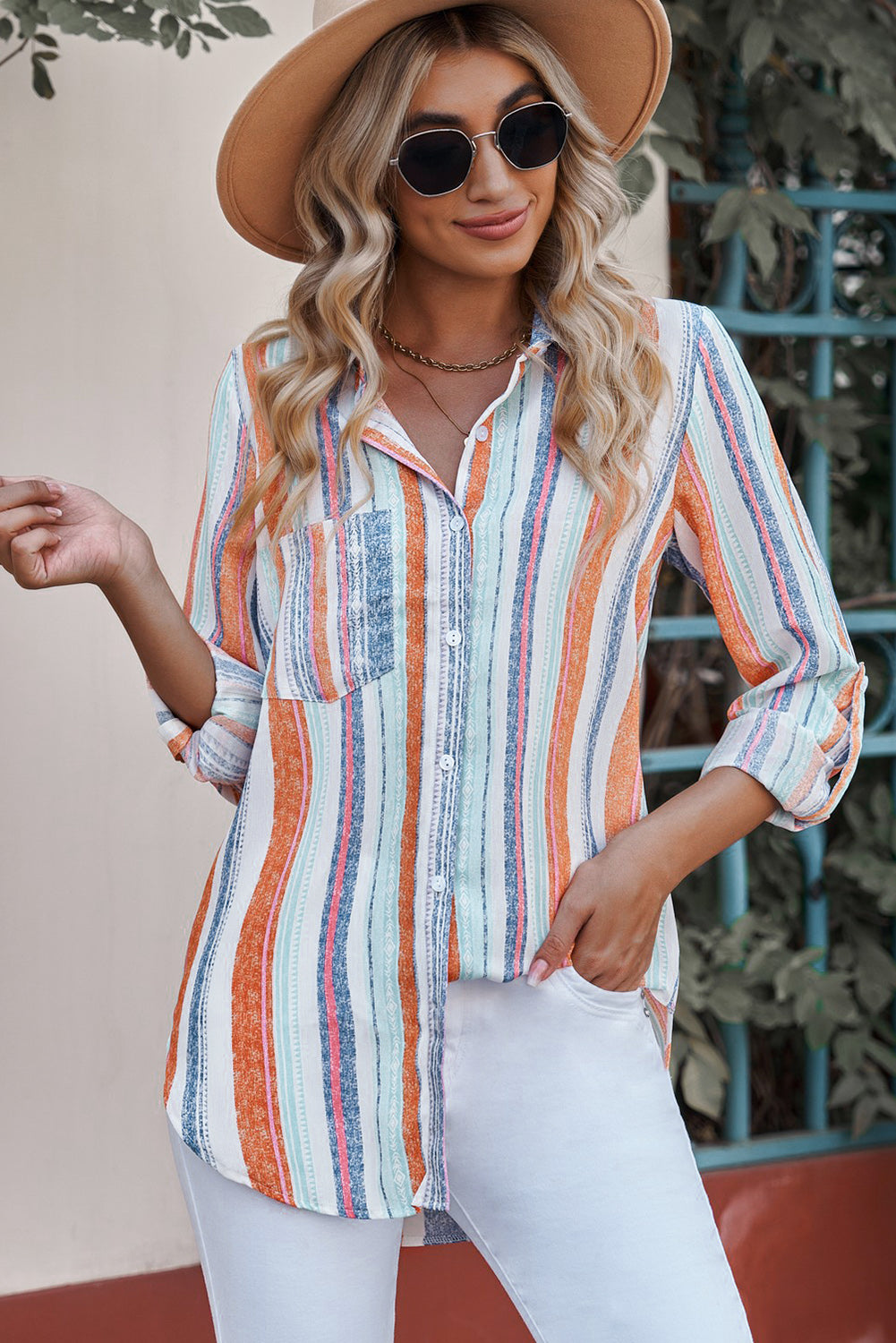 Coastal Stripe Button-Down Blouse in orange and blue with a relaxed fit and rolled sleeves.