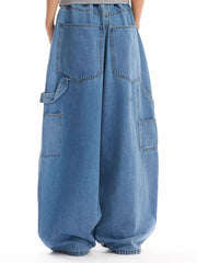 Classic wide-leg jeans in blue wash denim with angular pockets and a baggy fit.