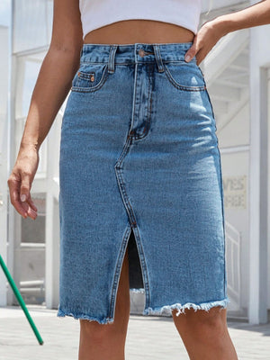 Light blue denim pencil skirt with frayed hem and front slit.